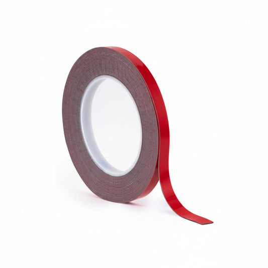 A single roll of ABRO Grey High Bond (GHB) double-sided acrylic foam tape standing upright. The image shows the grey adhesive core and the distinctive red protective liner, ideal for industrial-strength mounting and automotive applications.
